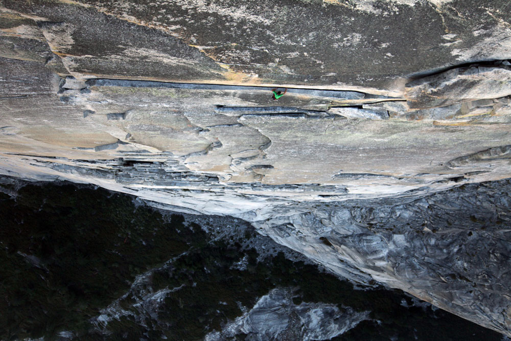 Alex "No Big Deal" Honnold, free solo, reaches the "Thank God Ledge" on Regular Northwest Face (5.12a) of Half Dome in 2008. Photo courtesy of REEL ROCK Film Tour.