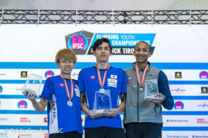 Photo of junior combined category podium, from left to right: Yoshiyuki Ogata of Japan, second place; Meichi Narasaki of Japan, first place; Kai Lightner of U.S.A., third place. Photo: Eddie Fowke.