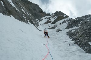 Alan Rousseau nearing their high point on the attempt of the north face. They hoped a bivy ledge would appear near the ice curtain at the top of the photo, but there were no ledges anywhere. Photo: Tino Villanueva.