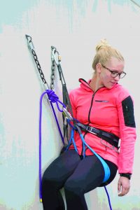 STEP 4: Clip the figure eight on a bight to your belay loop with one locking carabiner and one regular carabiner with the gate reversed. Now, while you are still on belay, you can untie, have your belayer “take,” and lower. Using this method, you are never off belay.