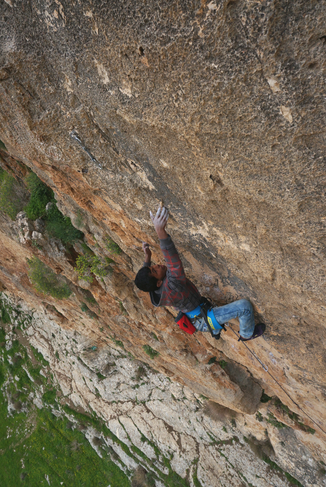 Twfyq, a Palestinian climber, on an Israeli route at Ein Fara. Photo: Miranda Oakley.