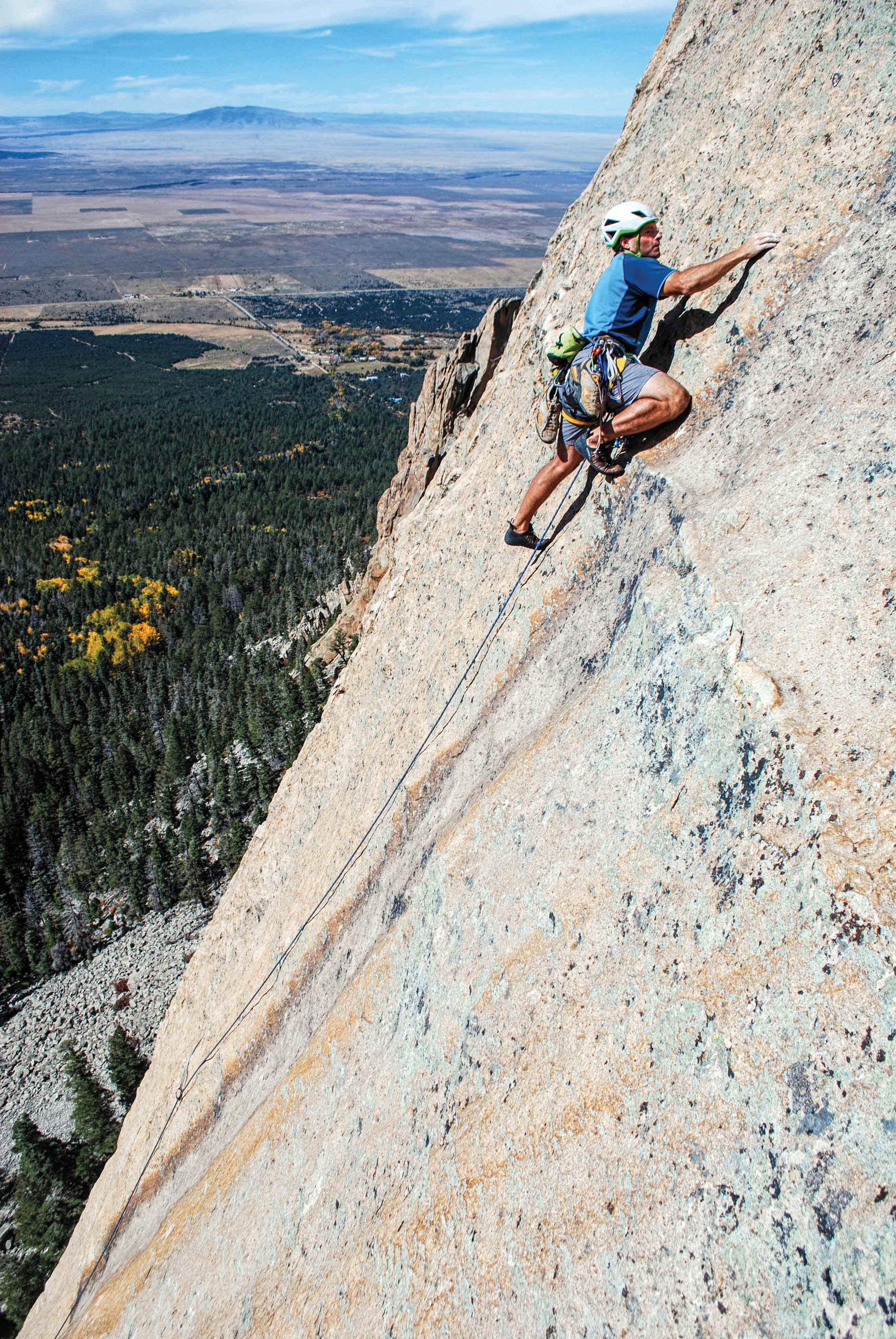Dan Greenwald walks proud on the 5.10R fourth pith of Question of Balance (5.11) on the quality stone of Questa Dome, near Taos, New Mexico. Photo: Stewart Green.