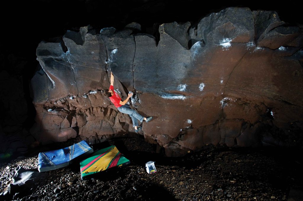 Mike McClure on Tomahawk Left (V6), the Channel Tubes, Idaho. Photo: Nathan Smith.