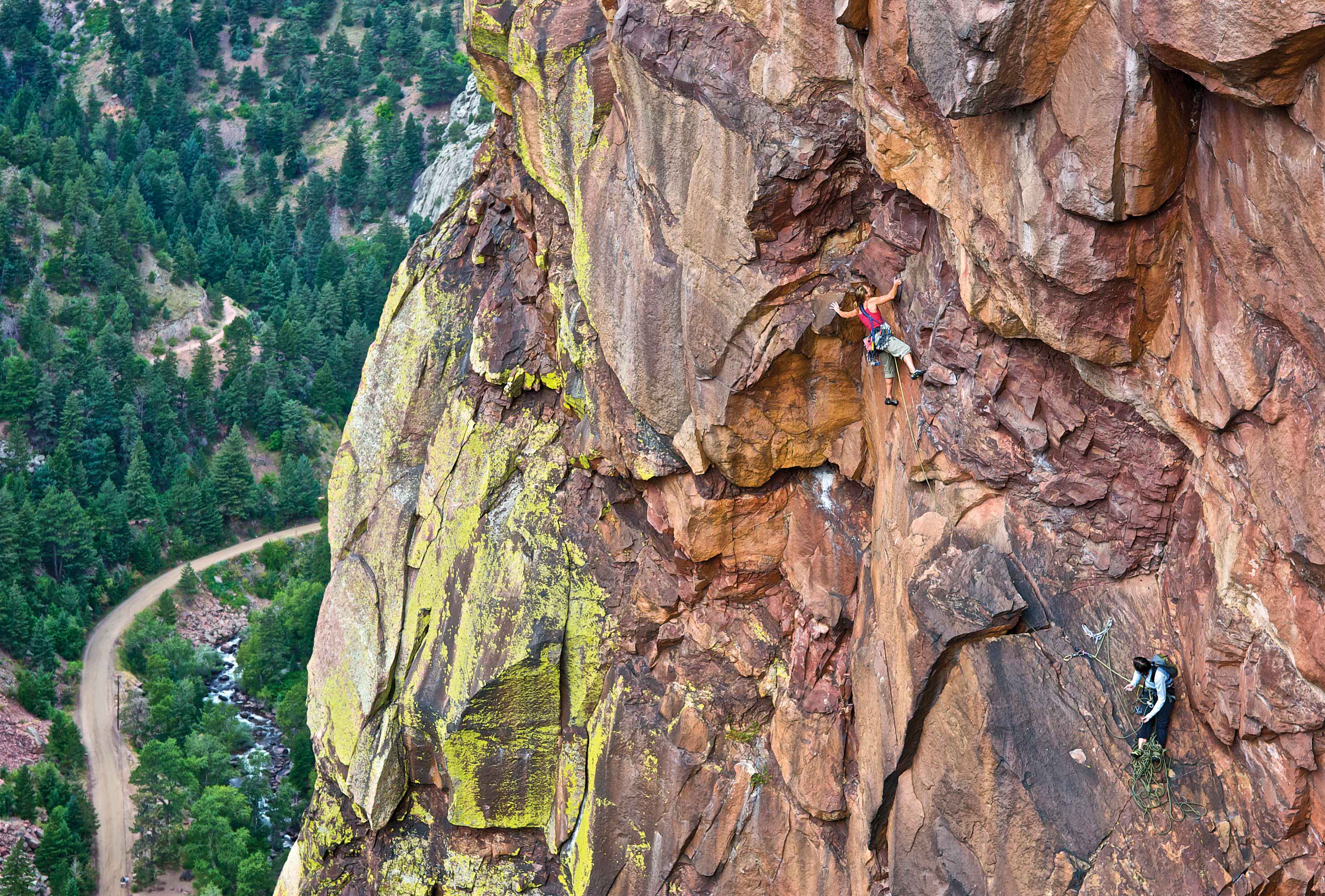 Sheyna Button belays Heidi Wirtz as she gets into the business of The Diving Board (5.11b) in Eldorado Canyon. Photo: Celin Serbo.