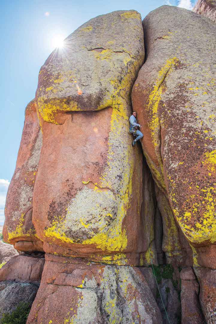 Derrick Wigglesworth loads up the Left Torpedo Tube (5.10d), The Nautilus, Vedauwoo. Photo: Nathan Smith.