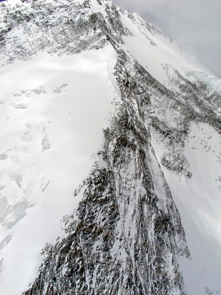At 7,200 meters between Camp 2 and Camp 3 on Dhauligiri last year, two Sherpas descend to save their lives. Three Chinese climbers are lost in the windstorm, but seven are saved by Fishtail Air and Air Zermatt.