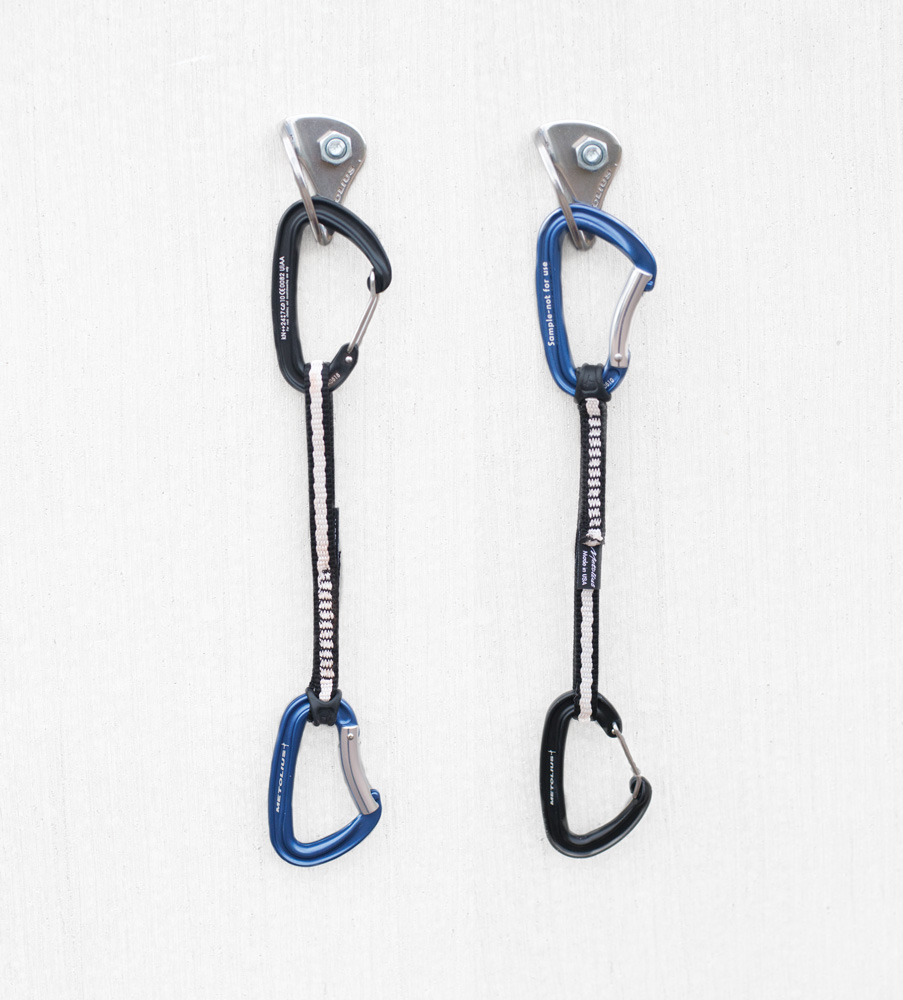 The left quickdraw is correctly clipped, with the bent-gate carabiner on the end that will receive the rope. The right quickdraw is incorrect—never clip a bolt or any pro with a bent-gate carabiner. The bent-gate could unclip itself. lead climbing