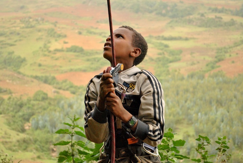 An Ethiopian boy belays at his local crag. Photo by Matt Roberts.