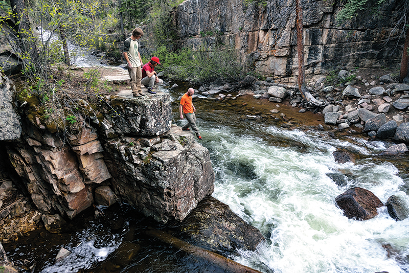 Chris Schulte, William Mondragon and Devin Finucane search for riverside bouldering in Lemon Dam. Photo: Keith Ladzinski.